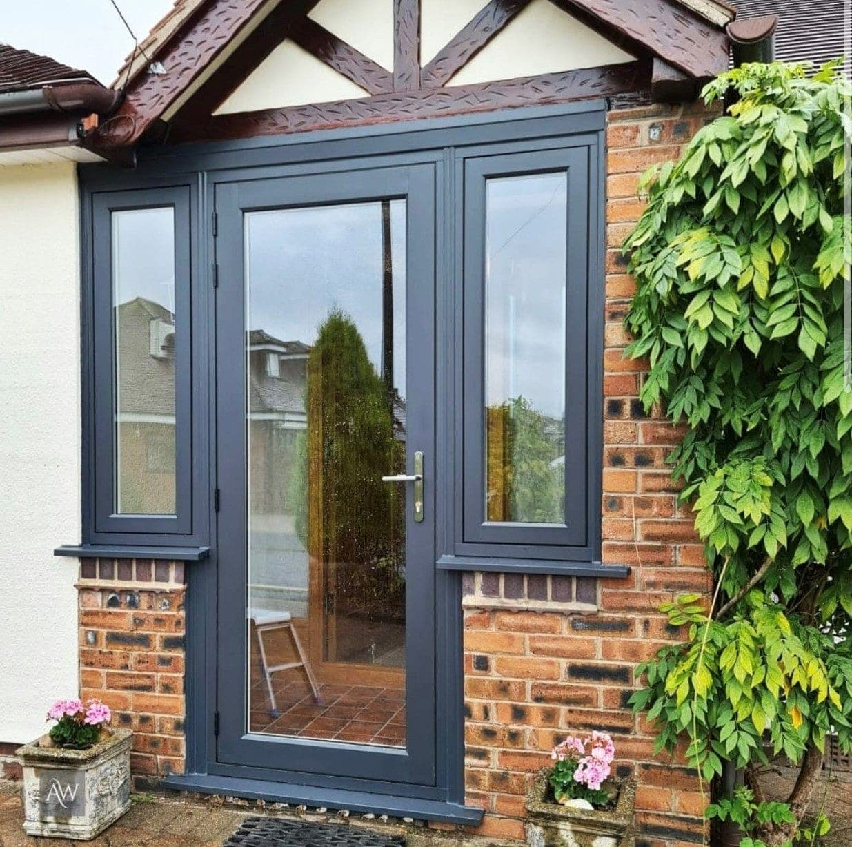 Residence Doors entrance door in Eclectic Grey with matching sidelights