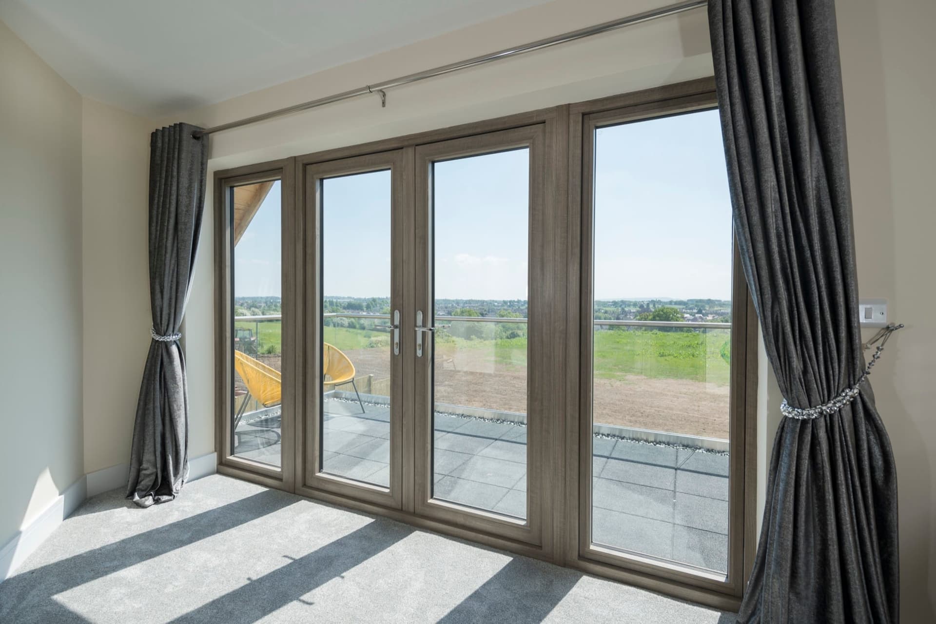 Aluminium sliding doors with slim sightlines giving an unobstructed panoramic view from inside a contemporary home