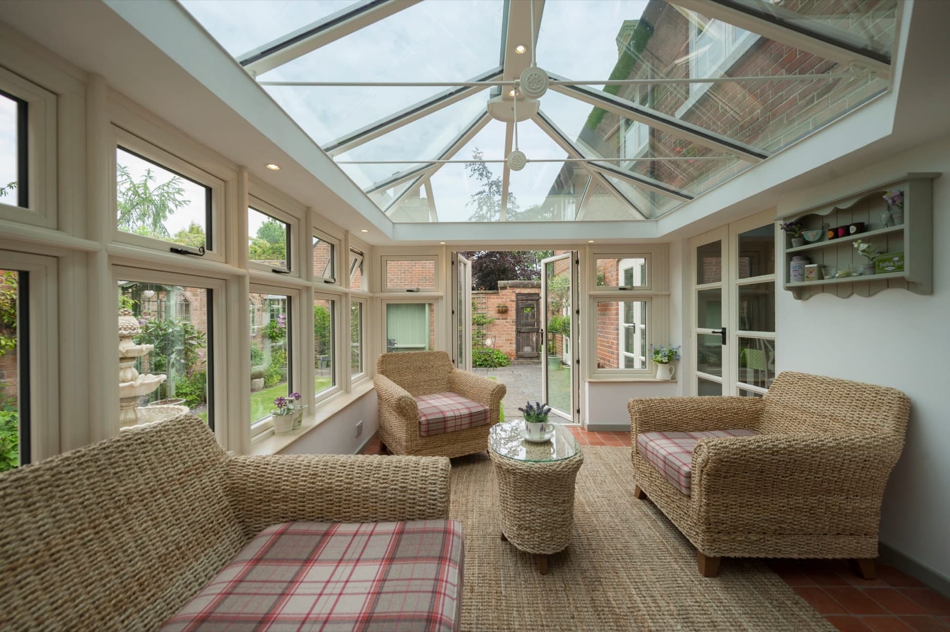 Modern lean-to conservatory interior with clean-lined glazed roof