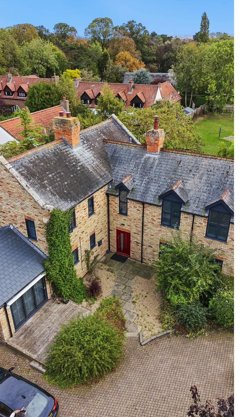 Stone cottage entrance with a new composite front door
