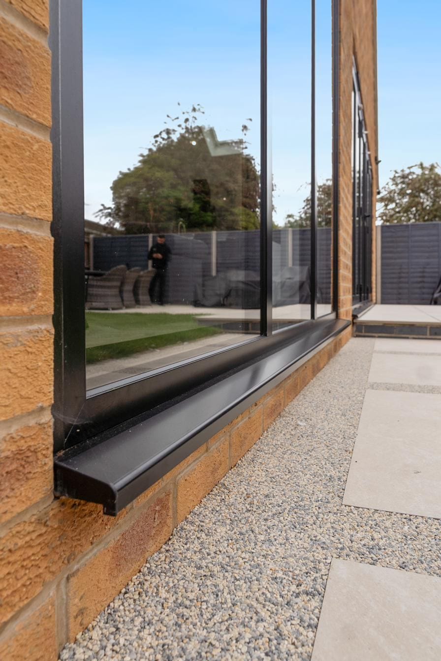 Origin Soho style aluminium window with steel-look glazing bars on a contemporary new build