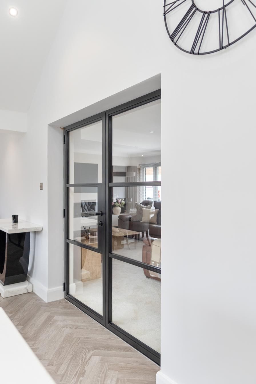 Crittal-style aluminium doors with slim sightlines on a heritage property