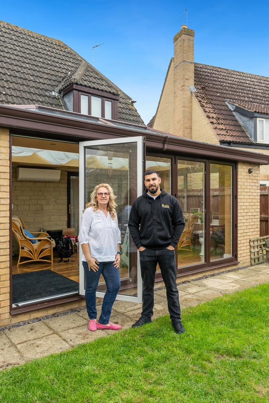 Tariq Quaddus with a Custom Choice customer at the completion of her conservatory