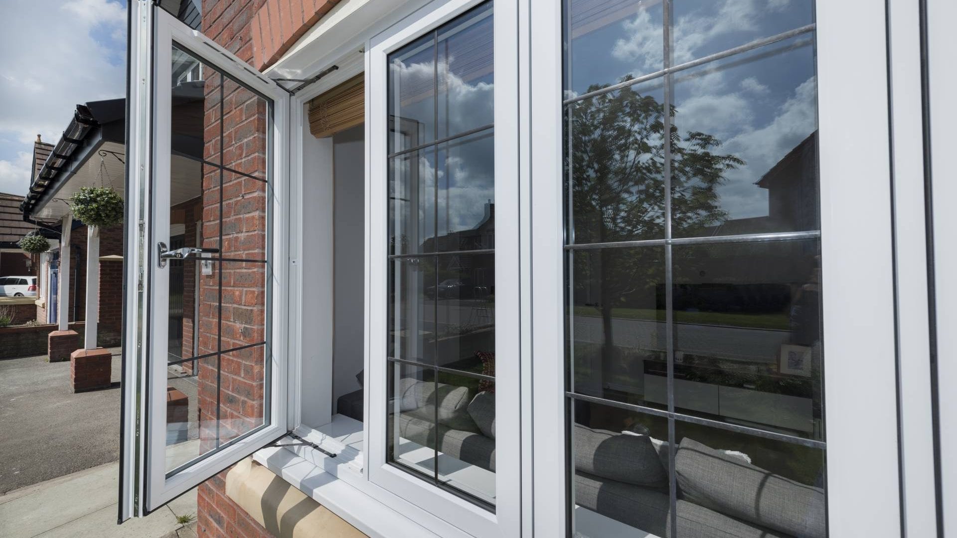 White uPVC casement bay window with leaded glass on a Peterborough home