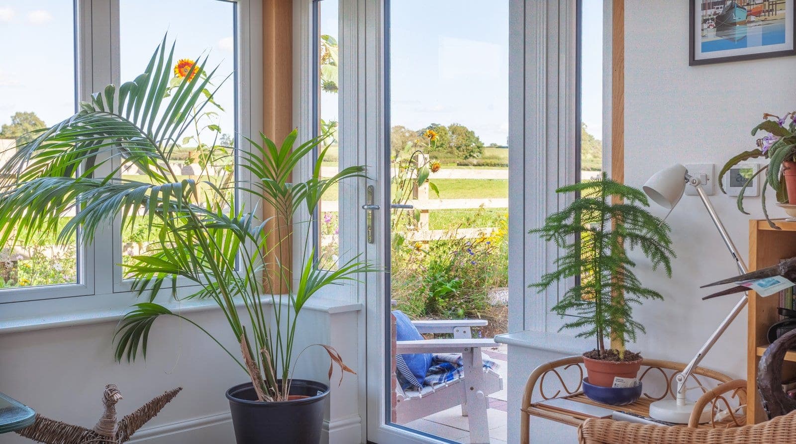 Residence 7 Chalk White flush sash windows seen from inside a home, looking out to a garden
